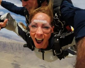 A girl takes a tandem skydive in Las Vegas at the Jean Airport from 12,000 feet