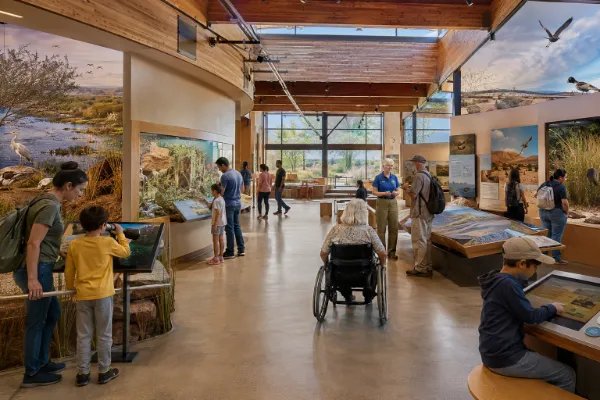 Families explore interactive wildlife and habitat exhibits inside the Clark County Wetlands Park Nature Center in Las Vegas.