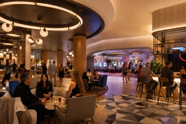Adult guests gather in the contemporary Commons Club near the casino floor inside Virgin Hotels Las Vegas.