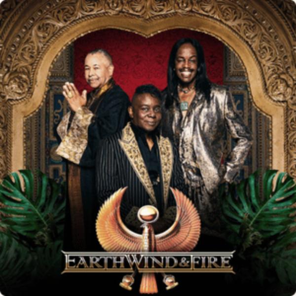 Earth Wind & Fire band members in ornate attire posing in front of golden Egyptian-inspired backdrop with winged sun disk logo