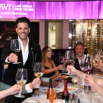 Friends enjoying a luxury wine tasting and toast in a Las Vegas fine dining establishment