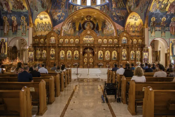 Visitors quietly view the Byzantine iconography and ornate sanctuary inside St. John the Baptist Greek Orthodox Church in Las Vegas.