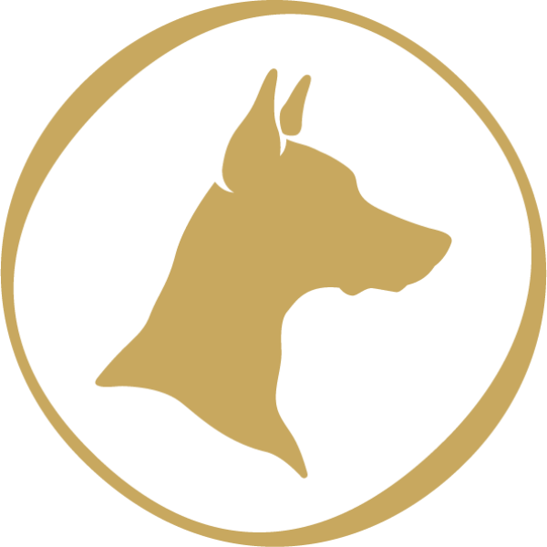Gold silhouette logo of a Doberman Pinscher's head in profile, enclosed in a circular border on a black background; emblem for Doberman Drawing Room cocktail lounge in Downtown Las Vegas.