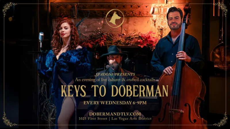 Cabaret performers at Keys to Doberman in Las Vegas Arts District with piano, double bass, and feathered costume in elegant lounge setting