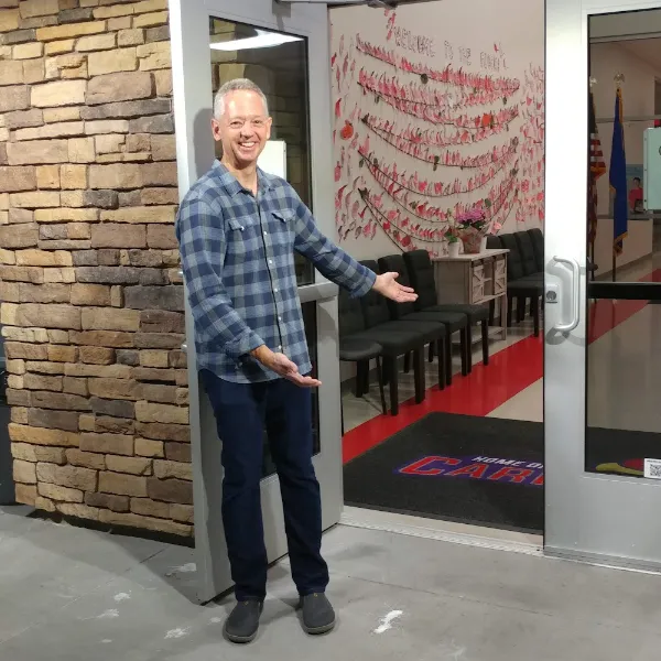 Pastor welcoming visitors at Desert Spring United Methodist Church entrance in Las Vegas