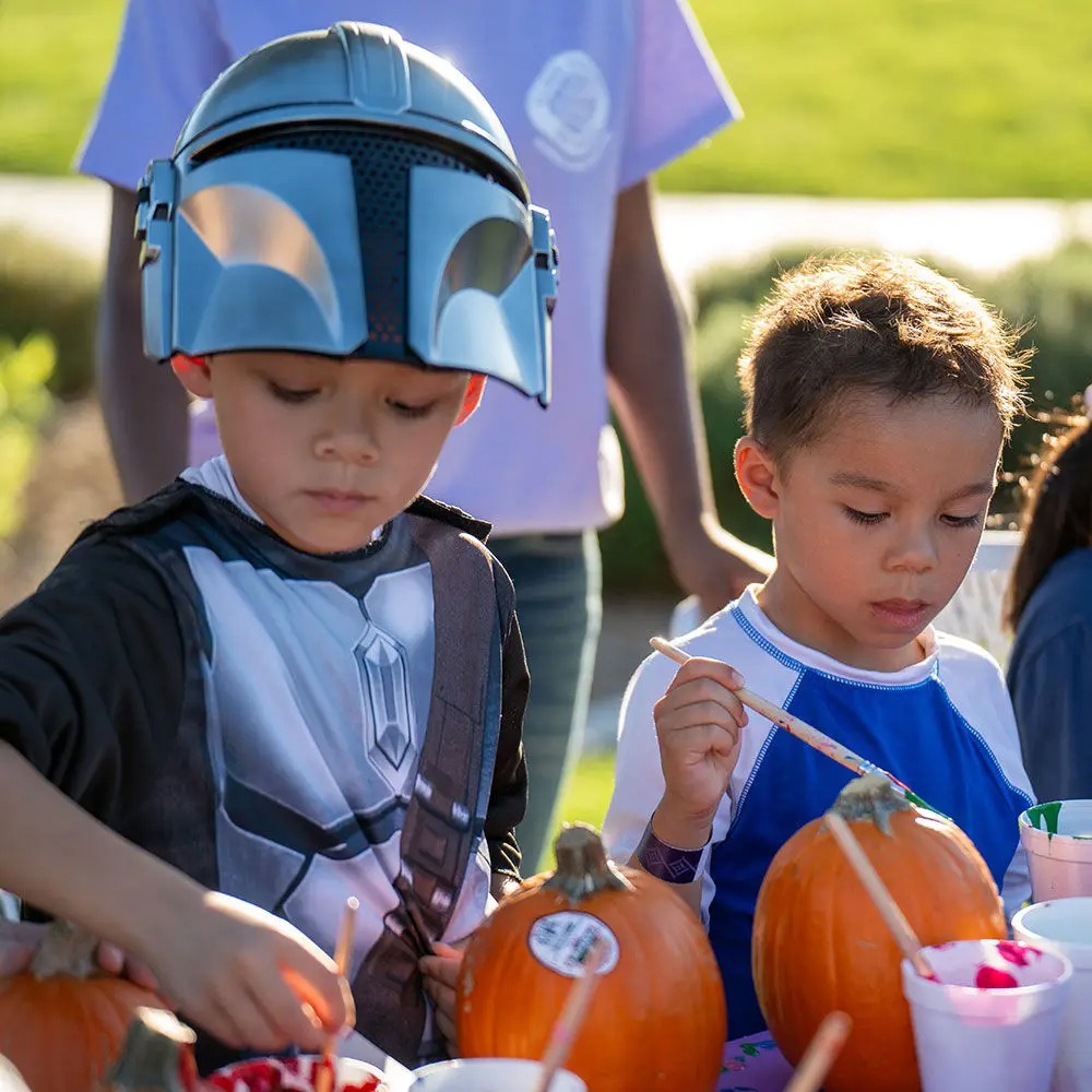 Kids painting pumpkins at Spooky Springs