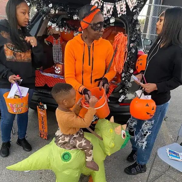 Family enjoying trunk-or-treat at Wicked Whitney