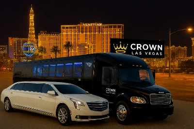Crown Las Vegas party bus and stretch limousine on the Strip at night with Venetian and Paris hotels in background
