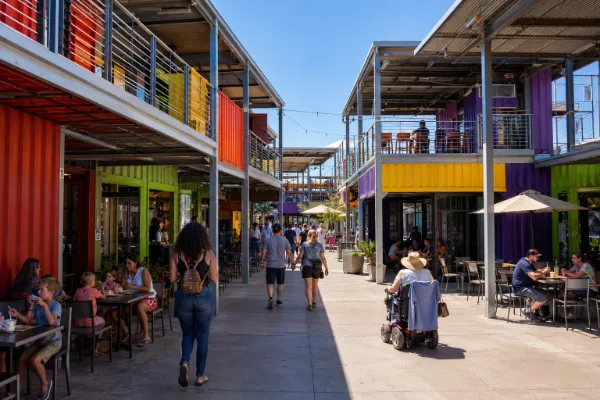 Guests dine and browse among the colorful storefronts and open-air walkways at Rick Harrison’s Pawn Plaza in Las Vegas.