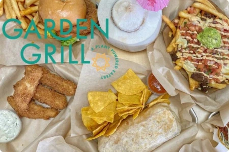vegan burger fries burrito coconut drink and dipping sauces at garden grill restaurant in las vegas