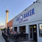 Able Baker Brewing Company in Las Vegas Arts District with outdoor seating, atomic bomb logo, and Stratosphere in background