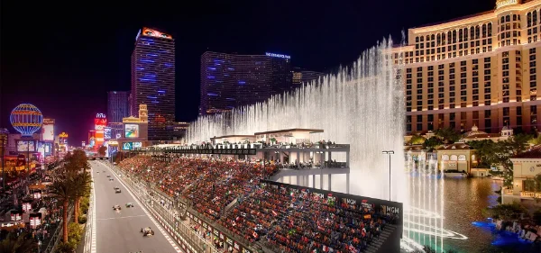 Formula One Grand Prix race at Bellagio Hotel Las Vegas with illuminated fountains grandstands and race cars on the Strip