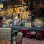 Doberman Drawing Room cocktail lounge in Downtown Las Vegas Arts District with vintage decor, taxidermy, and eclectic seating—popular First Friday stop