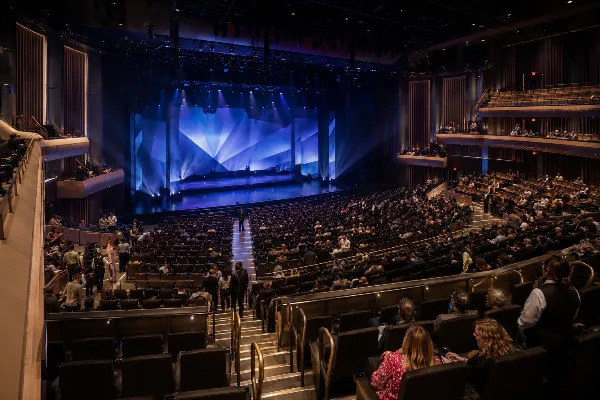 The Dolby Live auditorium at Park MGM features tiered seating, a broad stage, modern production lighting, and clear guest aisles.