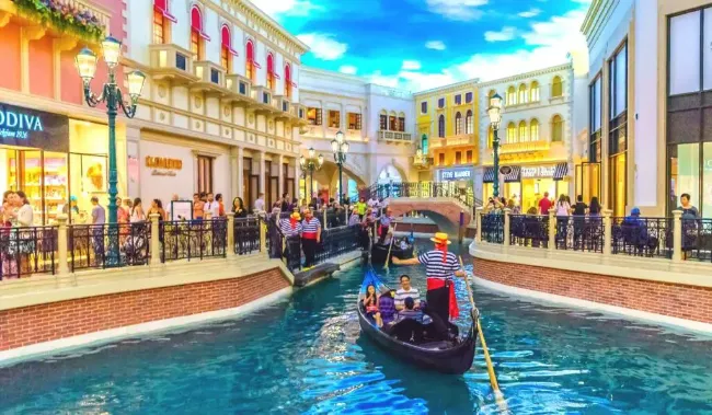 Gondola ride at The Venetian Resort Las Vegas with striped gondoliers ornate Venetian architecture and painted sky ceiling