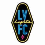 Las Vegas Lights FC logo styled as neon sign with diamond shape, cursive Lights, and pink star accent