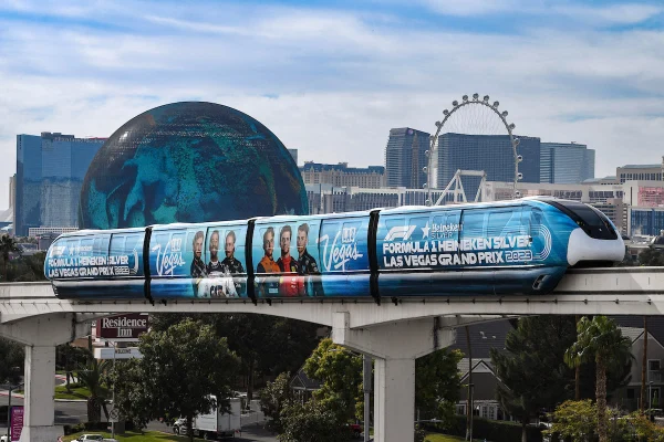 Las Vegas Monorail during Formula One Grand Prix Weekend with promotional wrap featuring drivers landmarks and event branding