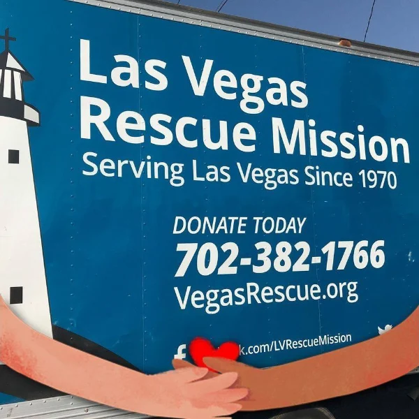 las vegas rescue mission truck with feeding nevada seniors message and donation contact info promoting food assistance and community outreach