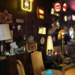 Rebar bar in Downtown Las Vegas Arts District with eclectic vintage decor, neon signs, and memorabilia—popular First Friday hangout