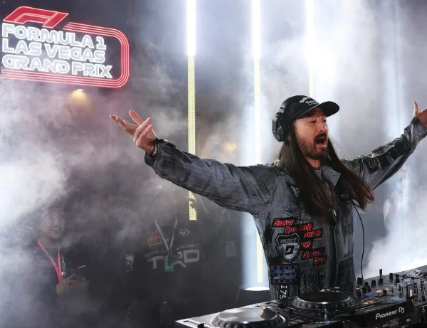 Steve Aoki electrifies the crowd during his DJ set at the Formula One Las Vegas Grand Prix with fog neon lights and high energy entertainment