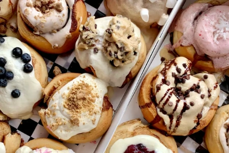 vegan cinnamon rolls with frosting and toppings in dessert box from cinnaholic bakery in las vegas
