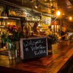 Velveteen Rabbit cocktail lounge in Downtown Las Vegas Arts District with warm lighting, vintage decor, and cozy bar seating a popular First Friday destination