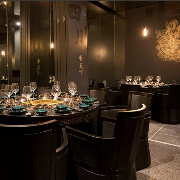 X Pot Restaurant at The Venetian Las Vegas with built in hot pot tables golden dragon wall art and upscale Asian inspired decor