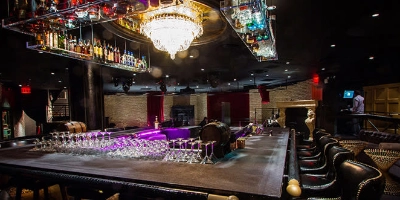 vintage-style speakeasy 1923 prohibition bar in las vegas with mirrored liquor ceiling plush seating and chandelier lighting evoking 1920s ambiance