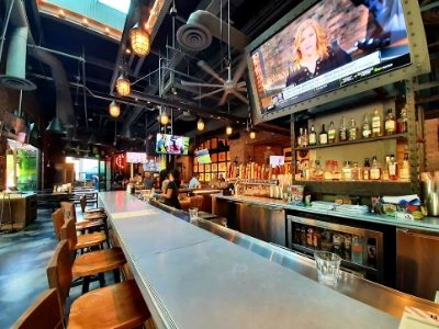 interior of 4 mile bar dive bar in las vegas with video poker machines karaoke setup and rustic decor