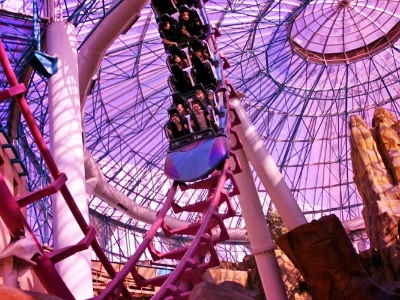 The Canyon Blaster roller coaster inside the pink dome of the Adventuredome at Circus Circus.