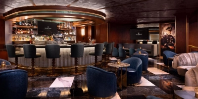 luxurious speakeasy caspians at caesars palace las vegas with illuminated bar plush seating and upscale cocktails in art deco setting