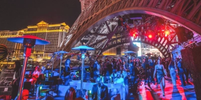 A romantic view of the Bellagio fountains from Chéri Rooftop lounge located directly under the Eiffel Tower at Paris Las Vegas