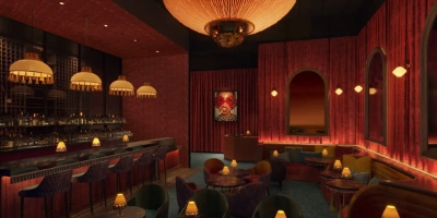 vintage-style speakeasy chez bippy at mgm grand las vegas with velvet seating nostalgic decor and craft cocktails behind luchini slice shop