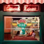 an outside look inside view of the coffee shop from Friends called Central Perk