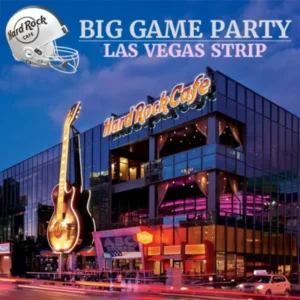 illuminated exterior of hard rock cafe on las vegas strip with giant guitar sign and promotional banner for big game super bowl party