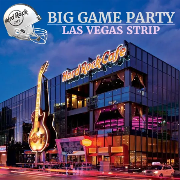 illuminated exterior of hard rock cafe on las vegas strip with giant guitar sign and promotional banner for big game super bowl party