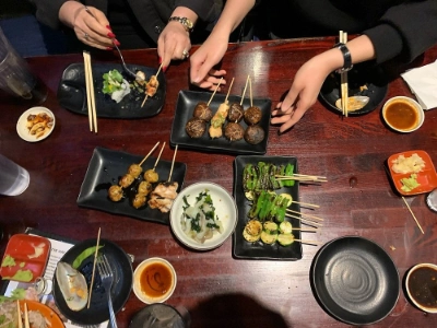 plate of yakitori skewers and sushi roll at izakaya go chinatown las vegas