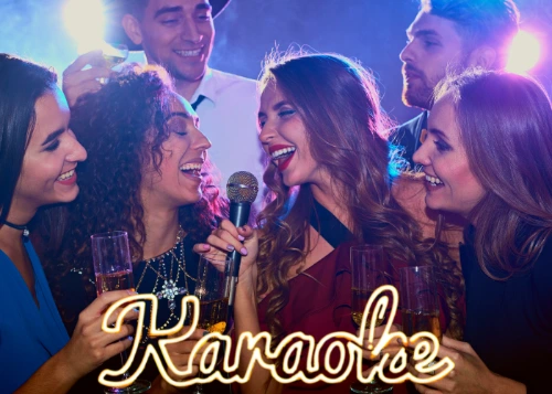 Group of friends singing karaoke together at a lively bar in Las Vegas