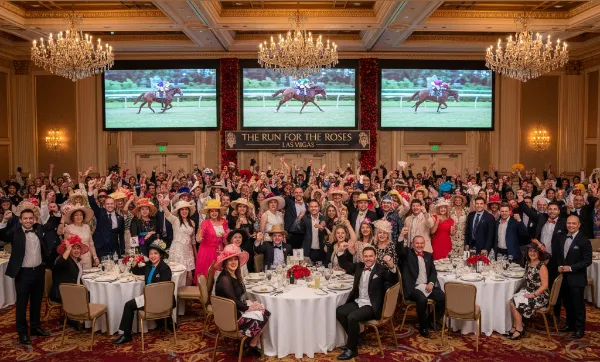 High-energy crowd cheering at a Kentucky Derby viewing party in a luxurious Las Vegas ballroom