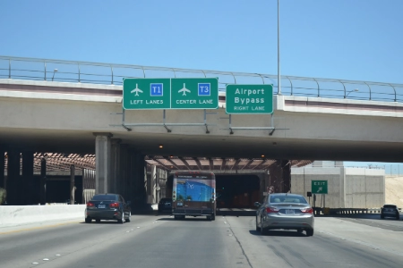 las vegas airport bypass tunnel with vehicles traveling under overpass