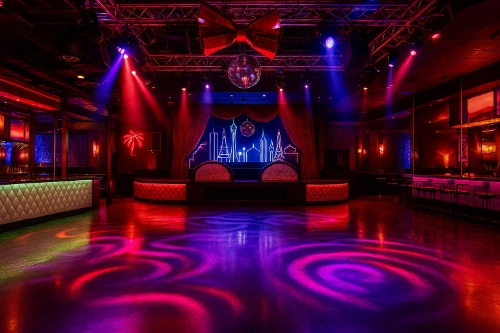vibrant las vegas lgbtq nightclub interior with neon lighting dance floor illuminated bar and drag stage