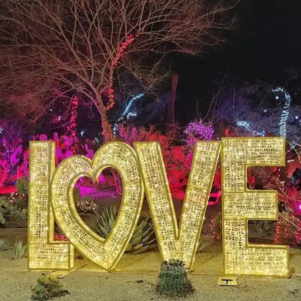 illuminated love sculpture and desert plants at ethel m chocolate factory henderson during valentines day lights of love event