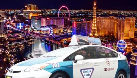 nellis cab taxi driving along las vegas strip at night with illuminated eiffel tower high roller and casino lights in background illustrating classic transportation and city nightlife