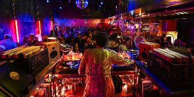 whimsical speakeasy-style bar at pier 17 yacht club in las vegas with nautical decor theatrical cocktails and immersive spiegelworld ambiance