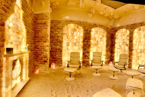 himalayan salt therapy room in summerlin las vegas with glowing walls and reclining chairs