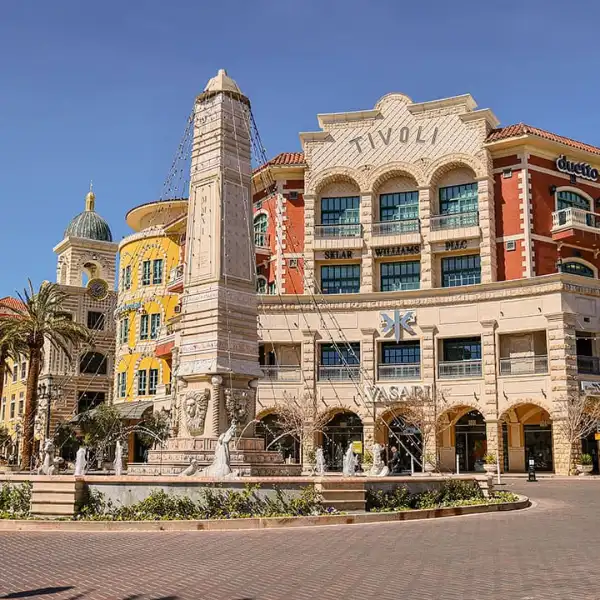 mediterranean-style architecture and fountain at tivoli village shopping center in summerlin las vegas with boutiques and palm trees