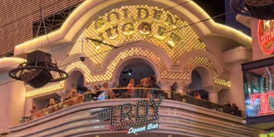 a view of the second-floor balcony of Troy Liquor Bar over the Fremont Street Experience