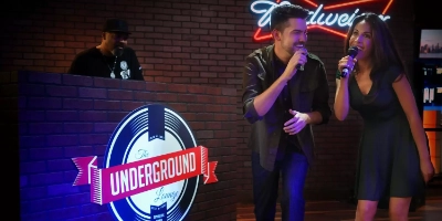 Two people singing a karaoke duet at Underground Lounge at OYO Hotel in Las Vegas