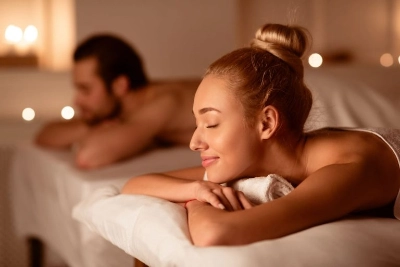 couple enjoying valentines day massage in las vegas spa with candles and peaceful ambiance