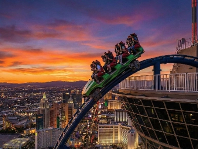 The X-Scream ride tilting riders over the edge of the STRAT tower.